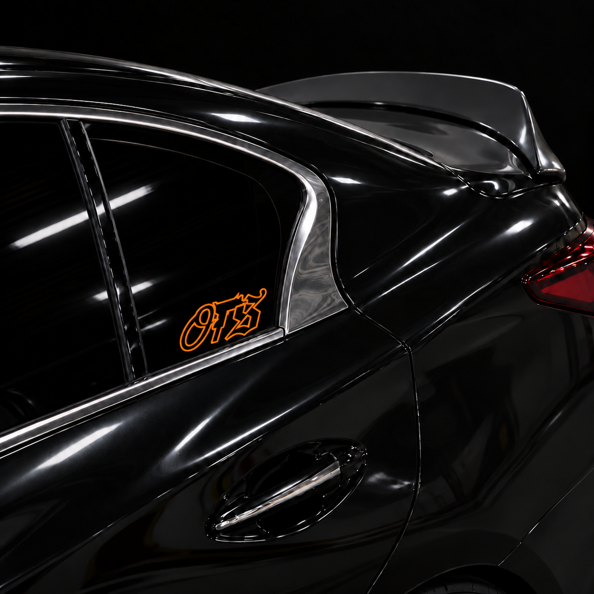 Orange OTS 6 x 2.5 inch outline vinyl, no fill, on a black car side window