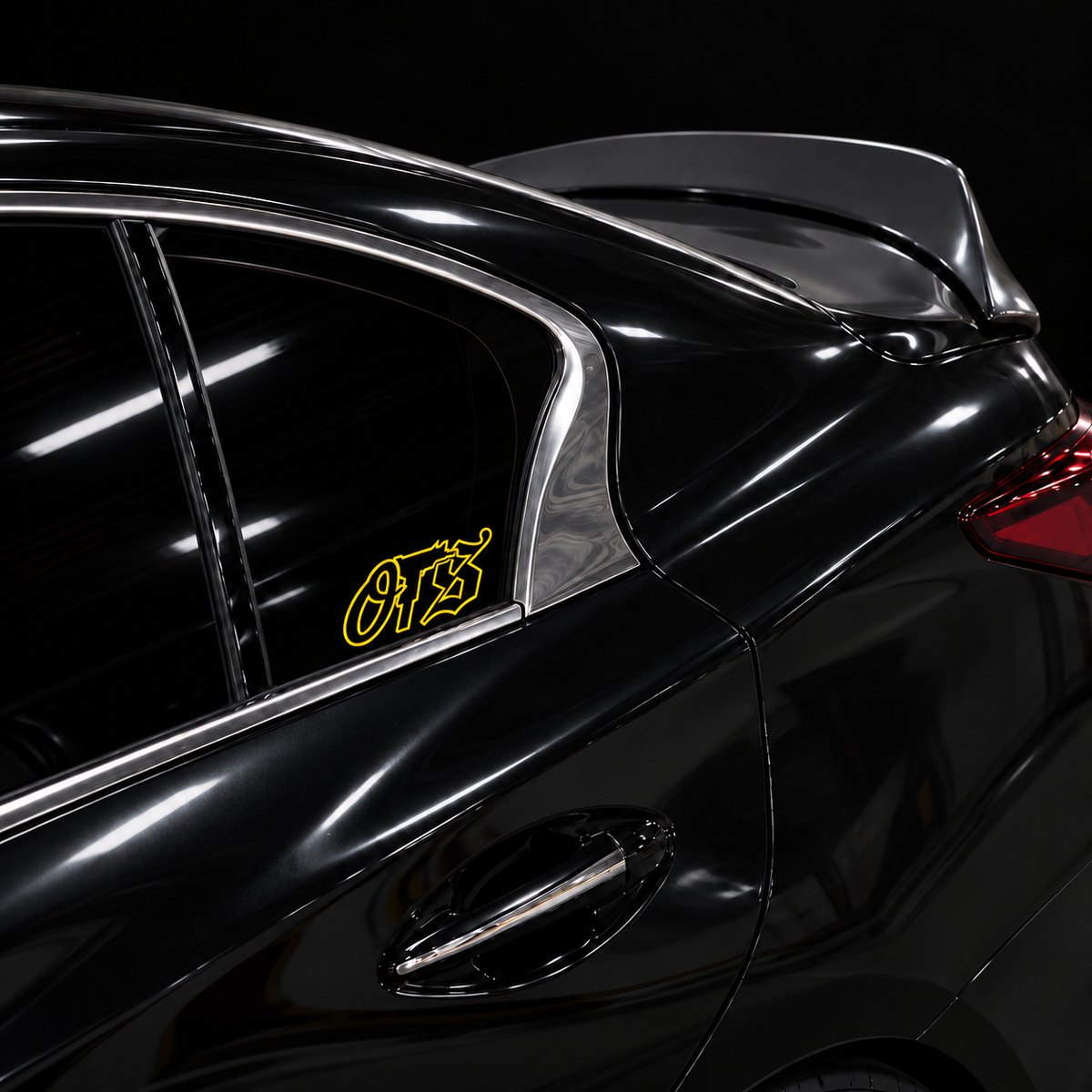 Yellow OTS 6 x 2.5 inch outline vinyl, no fill, on a black car side window