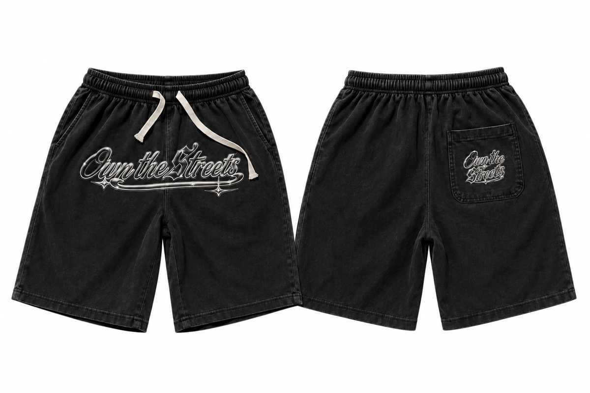 OTS black shorts with silver logo, front and back on white background